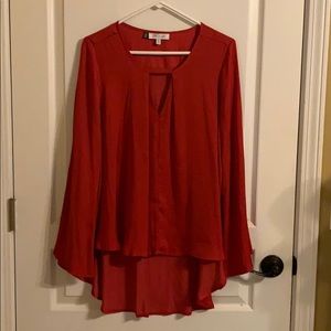 Jennifer Lopez silky red flowing top